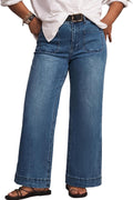 Eytino high-waisted plus size jeans in a medium blue wash, wide leg, full length on a model